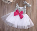 Silver sequin tutu dress with fuchsia bow and matching headband for baby girls