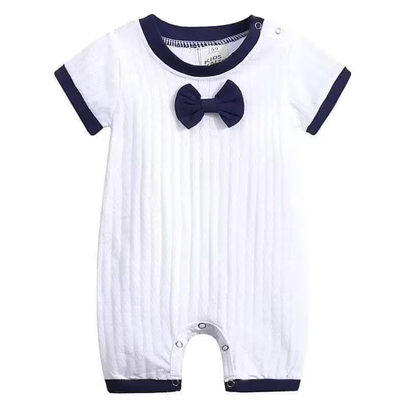 White textured baby boy romper with navy trim and bow tie